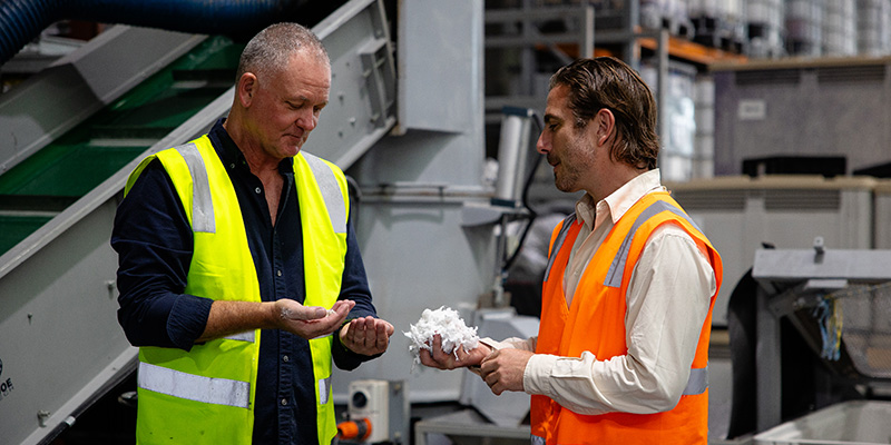 Founder of BlockTexx, Graham, inspect newly created pellets, made from recycled materials.