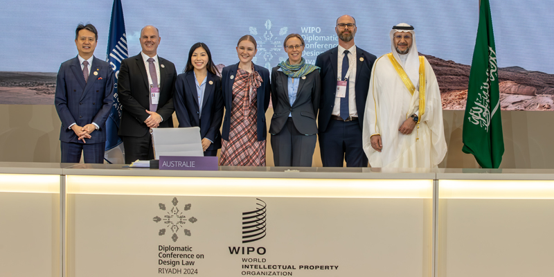 Australian Government representatives from IP Australia and the Department of Foreign Affairs stand together as the Treaty member countries 